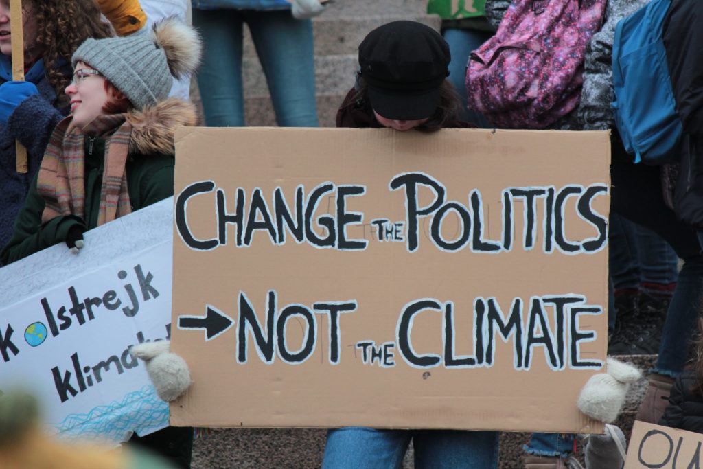Change the politics not the climate slogan at demo