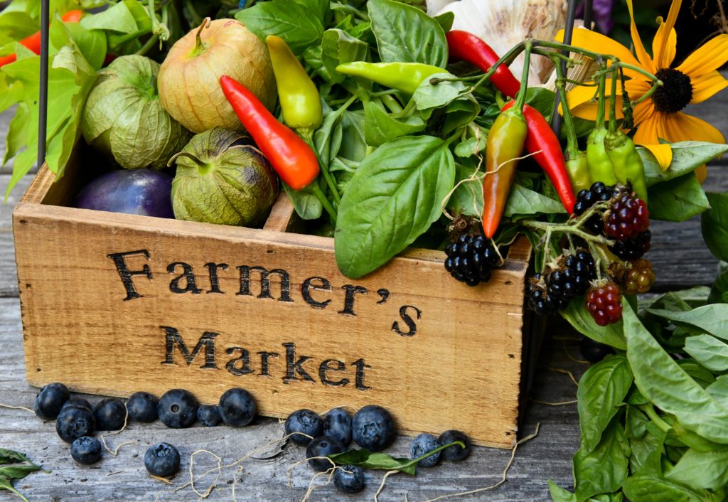 A box of organic food marked "Farmer's Market"