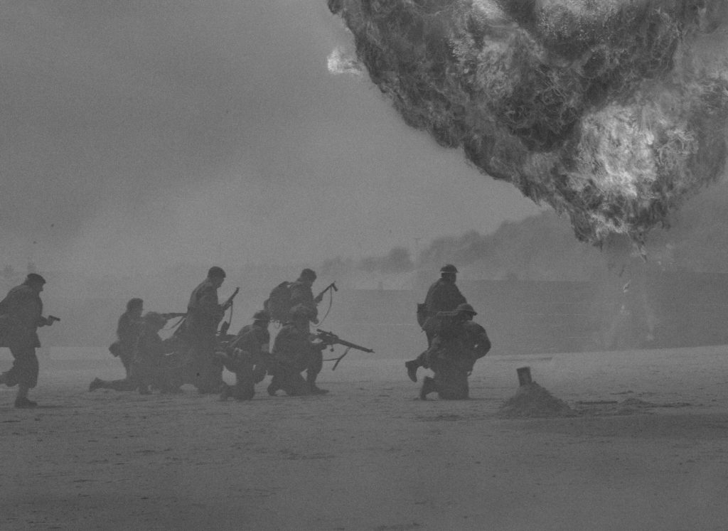 A group of soldiers advancing under fire
