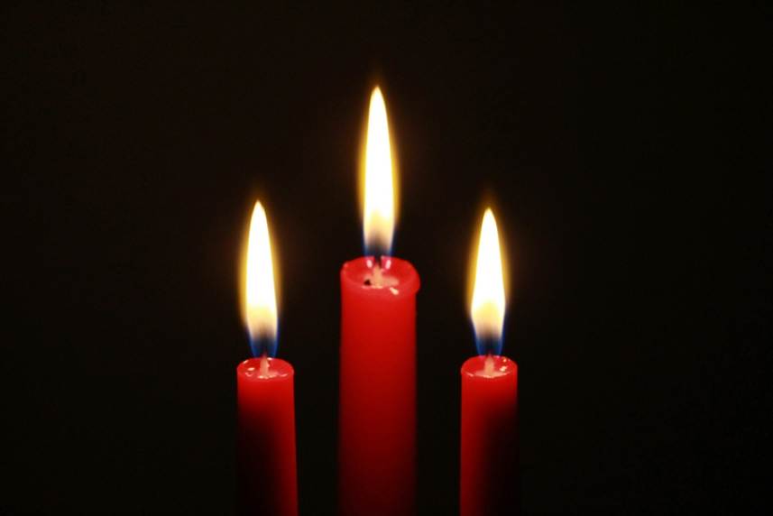 Three red candles burning brightly