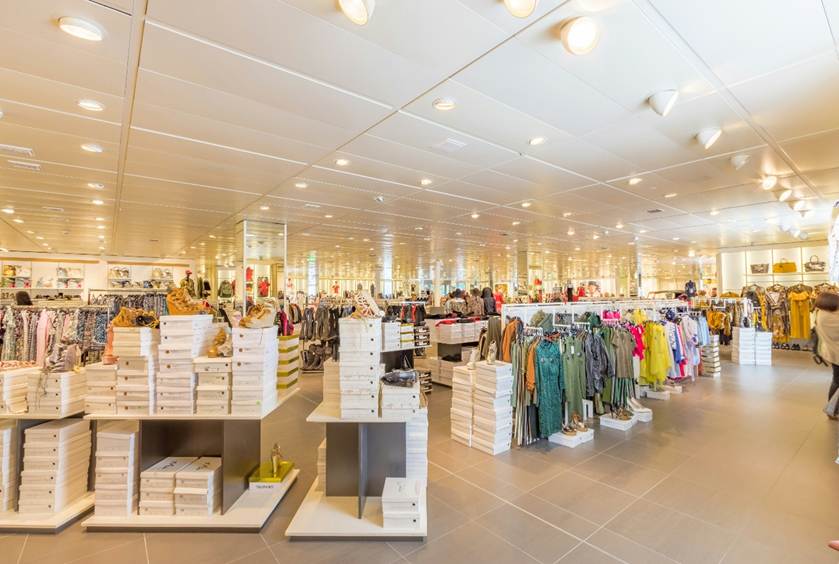 A clothing shop with a wide variety of colourful clothes