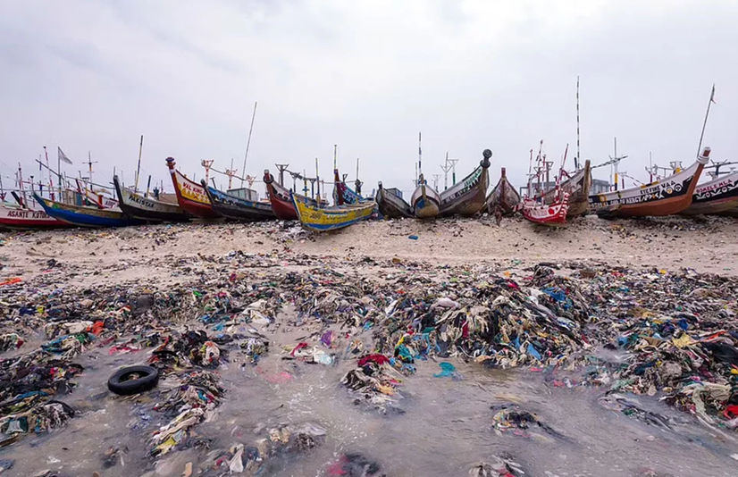 An African beach littered with clothing waste 