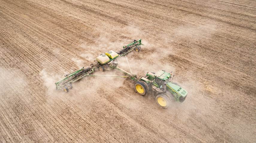 Pesticide being sprayed on a barren field