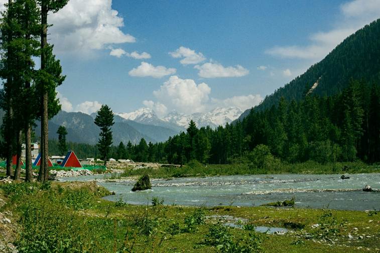 A view of mountains, a river and tree in the Swat valley
